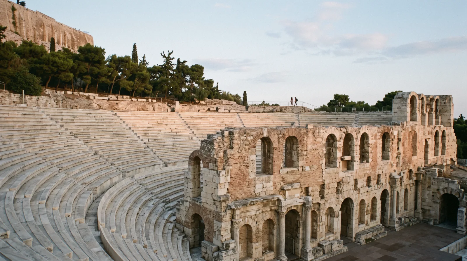 The stone tiers and Roman stage wall of the Odeon of Herodes Atticus below the Acropolis in Athens, Greece
