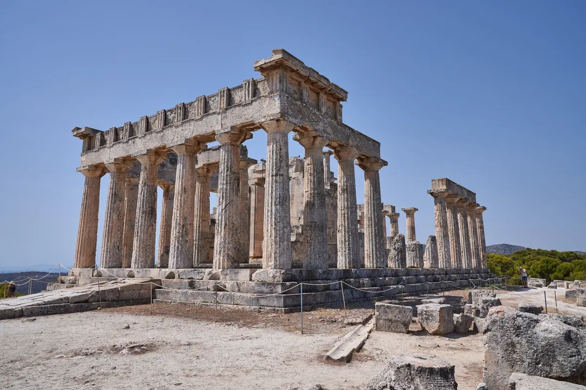 The standing Doric columns of the Temple of Aphaia on the ridge above Agia Marina, Aegina, a day trip from Athens, Greece
