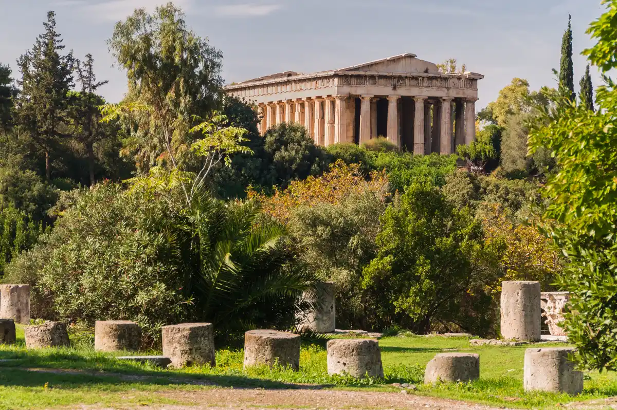 The Temple of Hephaestus above the Ancient Agora of Athens, Greece, with fallen column drums in the foreground