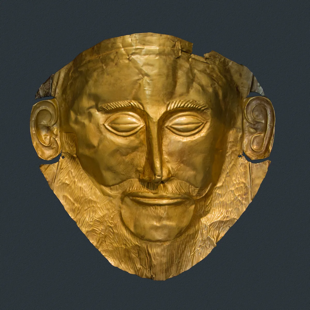 The gold death mask known as the Mask of Agamemnon in the National Archaeological Museum in Athens, Greece